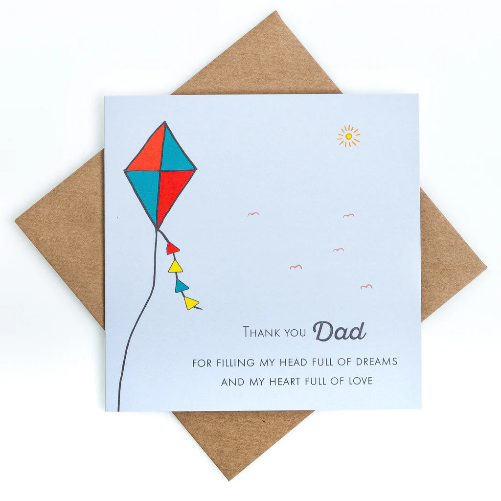 Greeting card with a colorful kite illustration and message for dad on a white background.